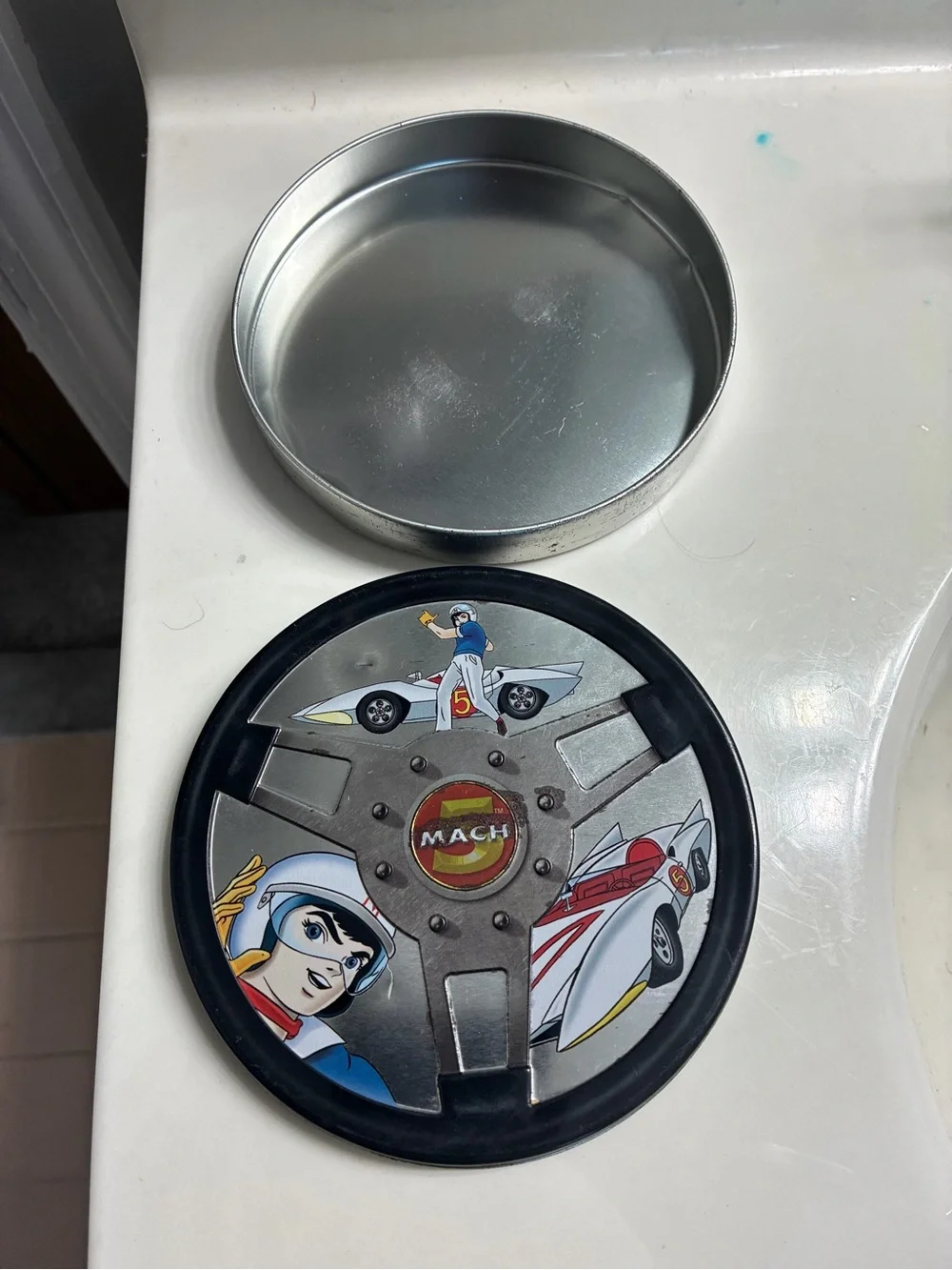 Collectable Speed Racer steering wheel-shaped empty tin DVD case or trinket tin